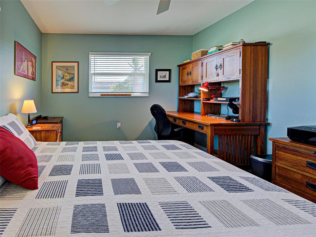 1350 Lakeside Drive Venice, FL 34293 - Photo 32 of 64 a bedroom with a bed and a cabinets