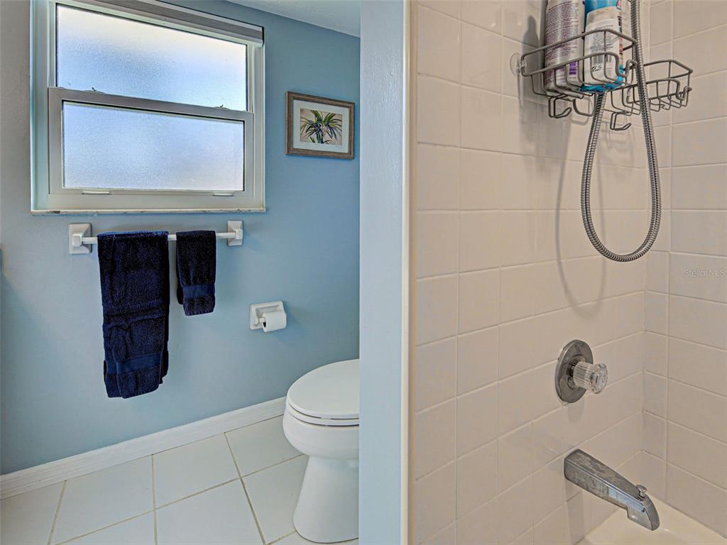 1350 Lakeside Drive Venice, FL 34293 - Photo 36 of 64 a bathroom with a toilet and a shower