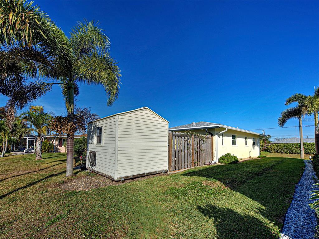 1350 Lakeside Drive Venice, FL 34293 - Photo 39 of 64 a view of a white house with a yard