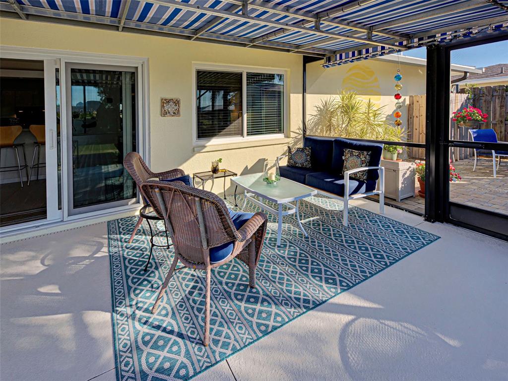 1350 Lakeside Drive Venice, FL 34293 - Photo 46 of 64 a patio with glass top table and chairs