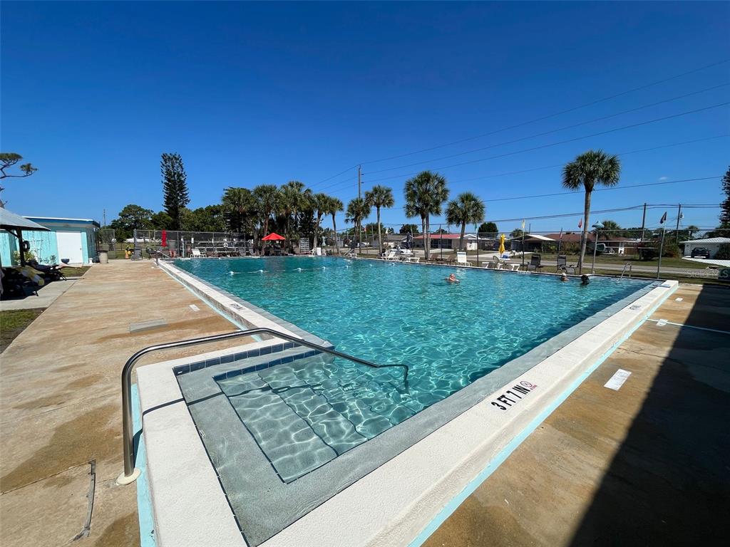 1350 Lakeside Drive Venice, FL 34293 - Photo 59 of 64 a view of a swimming pool with a patio