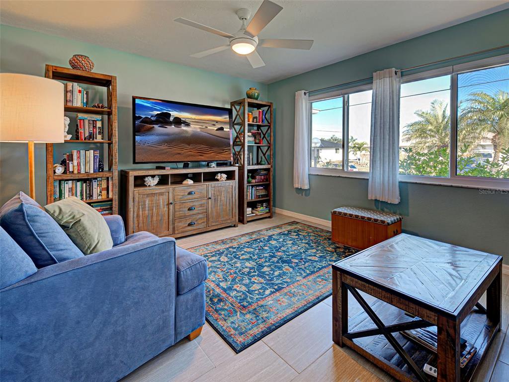 1350 Lakeside Drive Venice, FL 34293 - Photo 6 of 64 a living room with furniture and a flat screen tv