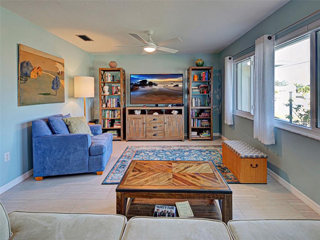 1350 Lakeside Drive Venice, FL 34293 - Photo 7 of 64 a living room with furniture and a flat screen tv