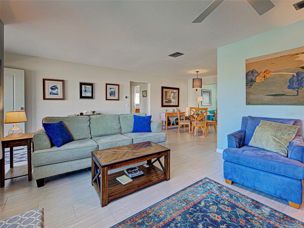1350 Lakeside Drive Venice, FL 34293 - Photo 8 of 64 a living room with furniture and wooden floor