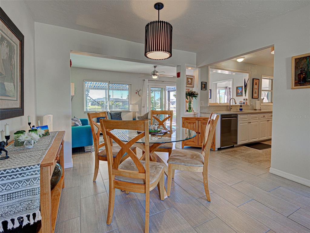 1350 Lakeside Drive Venice, FL 34293 - Photo 9 of 64 a view of a dining room with furniture and a chandelier