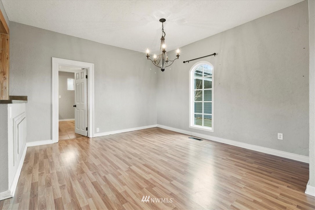 2312 Rice Road Chehalis, WA 98532 - Photo 10 of 39 a view of an empty room with wooden floor and a window