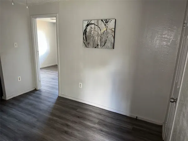 a view of an entryway with wooden floor