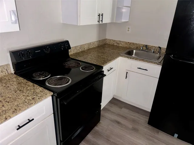 a close view of a stove and a sink