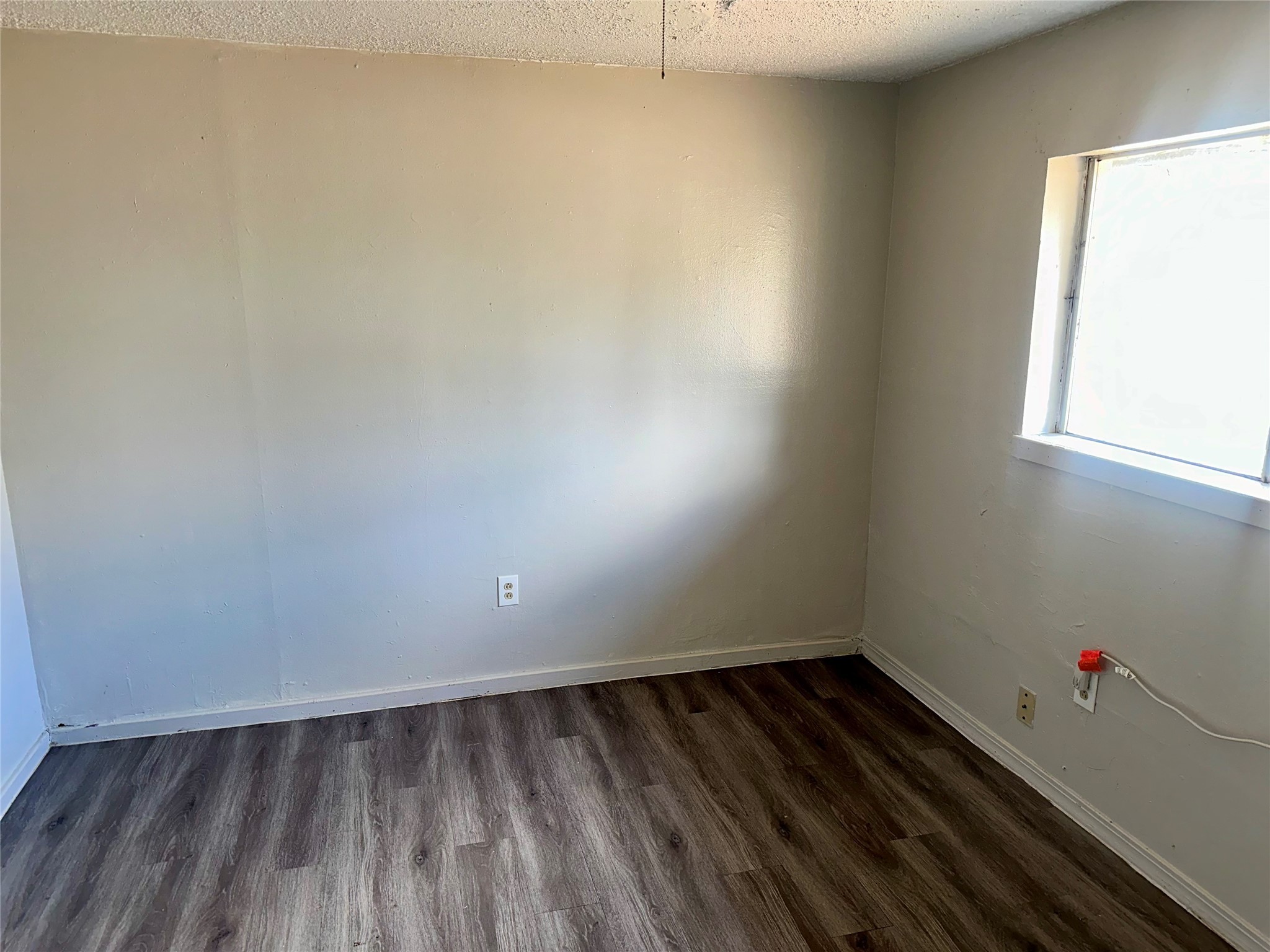 5405 Suez Street, Unit 1 Houston, TX 77020 - Photo 8 of 17 a view of a room with wooden floor and window