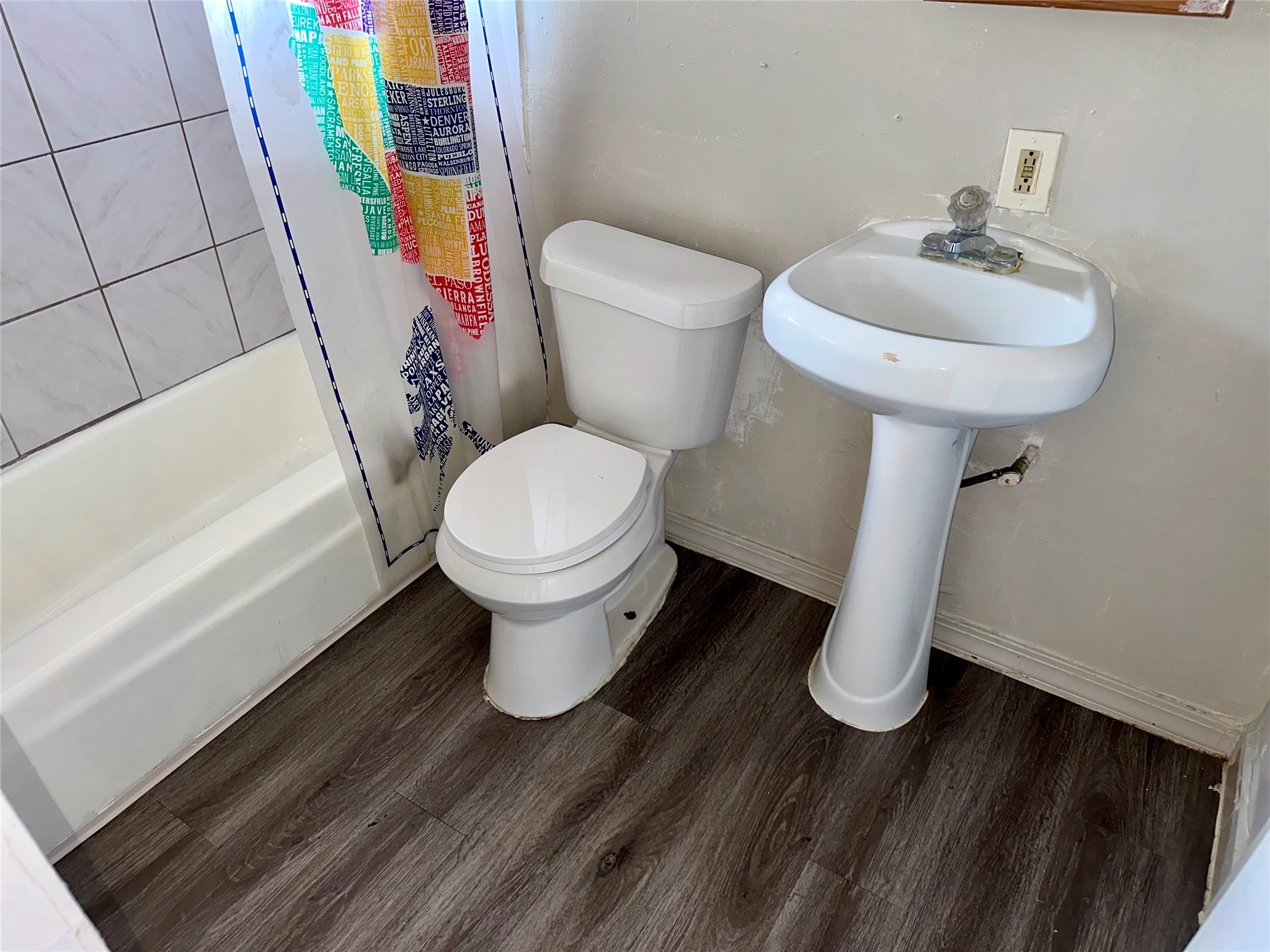 5405 Suez Street, Unit 1 Houston, TX 77020 - Photo 10 of 17 a white toilet sitting next to a bathroom sink