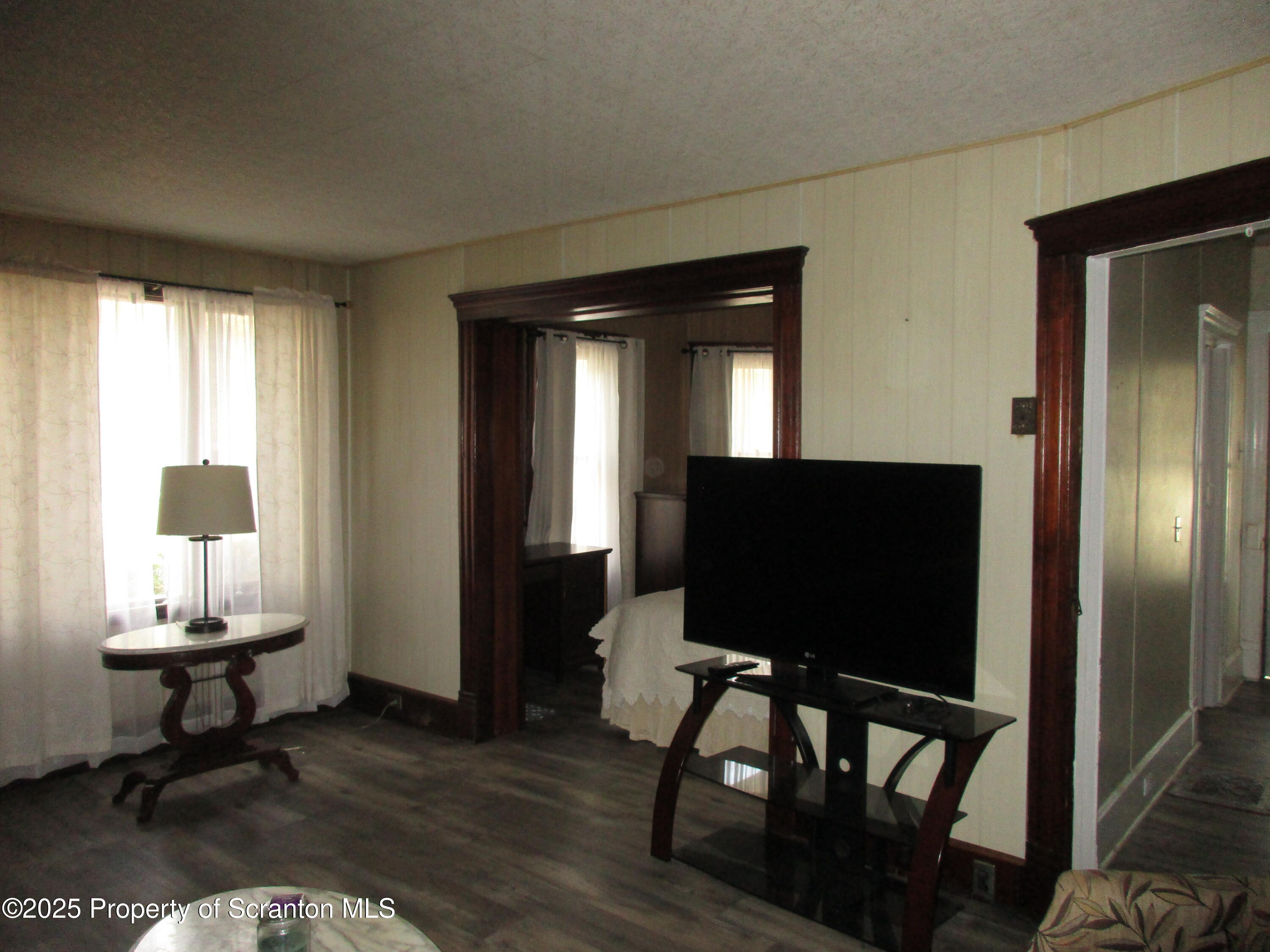 24 Oak Street Nicholson, PA 18446 - Photo 5 of 17 a living room with furniture and a flat screen tv