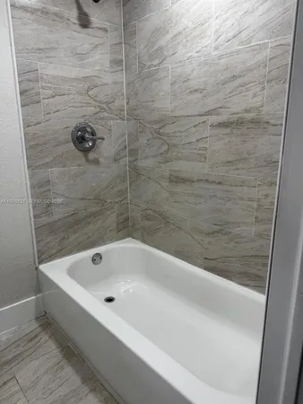a bathroom with a bathtub