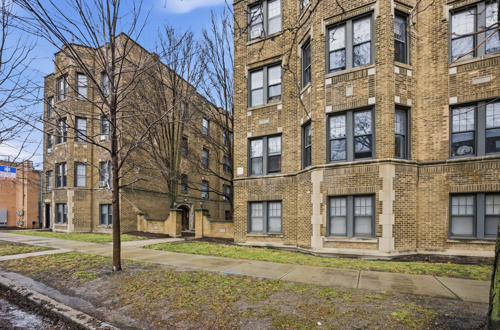 a street corner with a building in the background