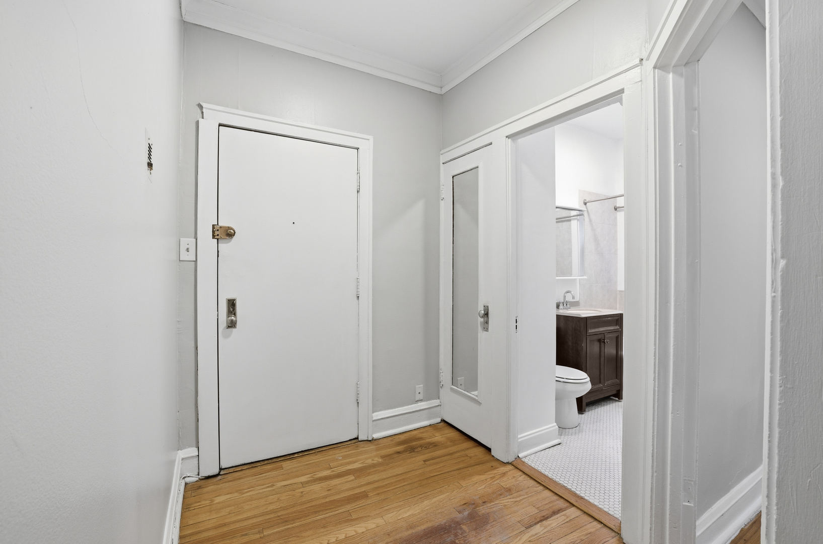 2336 West Addison Street, Unit I2 Chicago, IL 60618 - Photo 15 of 17 a view of a bathroom with a tub and shower
