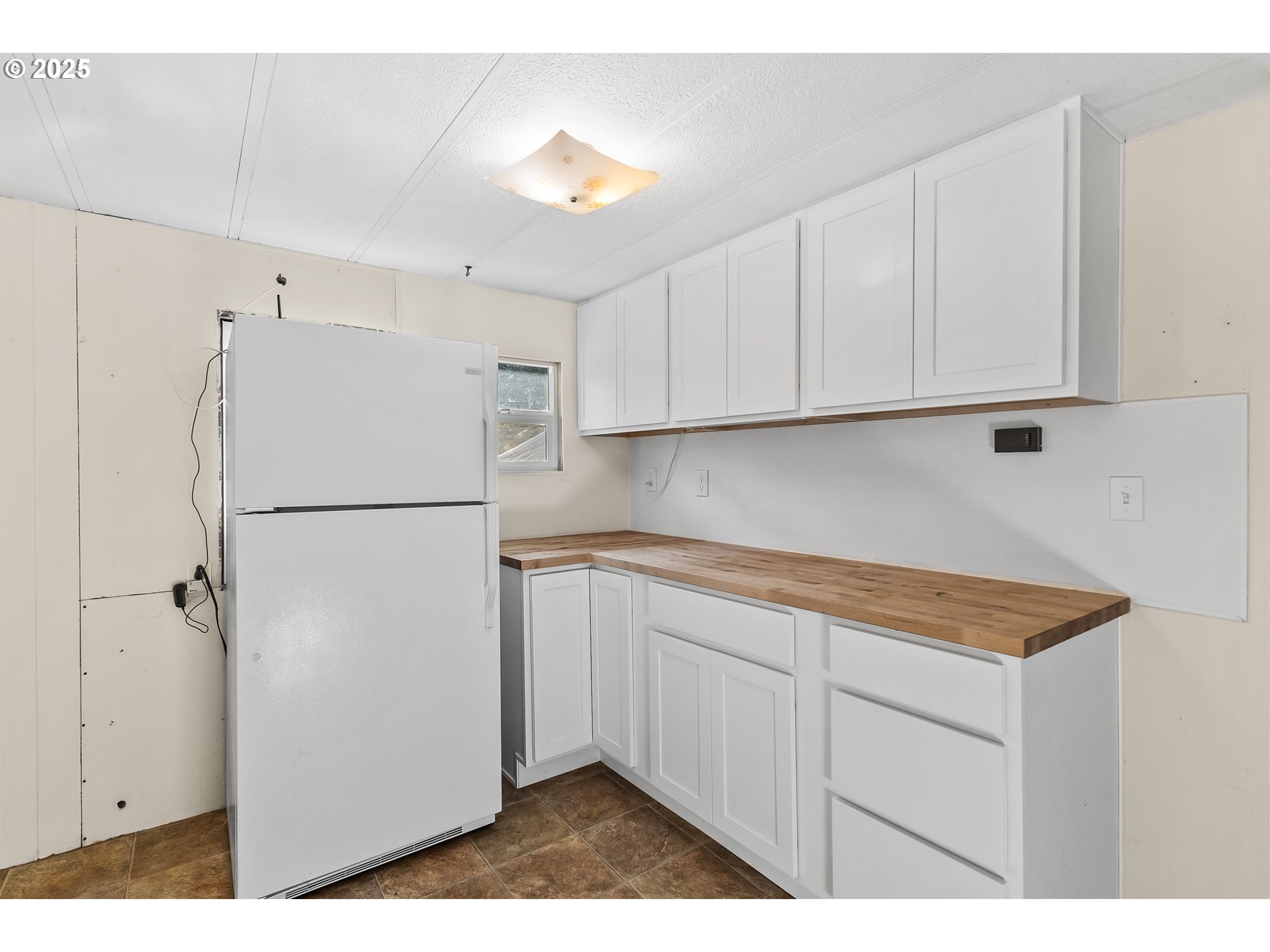 15779 Highway 42 Myrtle Point, OR 97458 - Photo 9 of 33 a utility room with cabinets washer and dryer