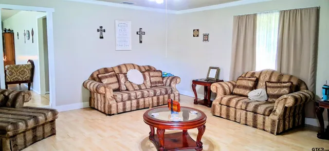 a living room with furniture and a window