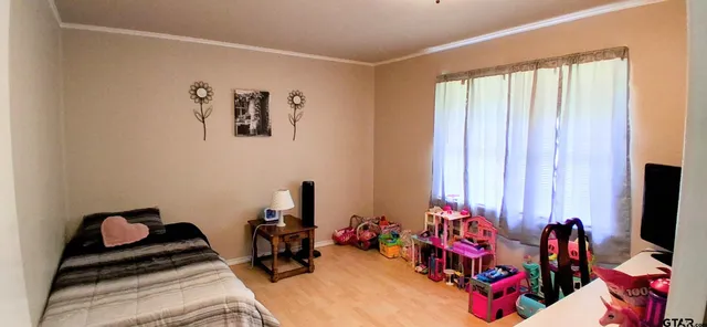 a room with furniture and a flat screen tv