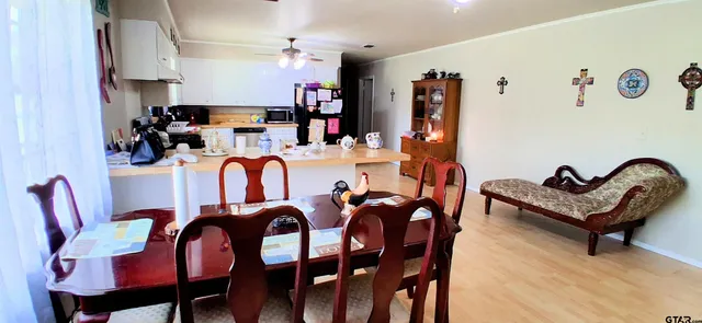 a view of a dining room with furniture and rug kitchen