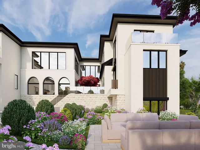 a front view of house with a garden