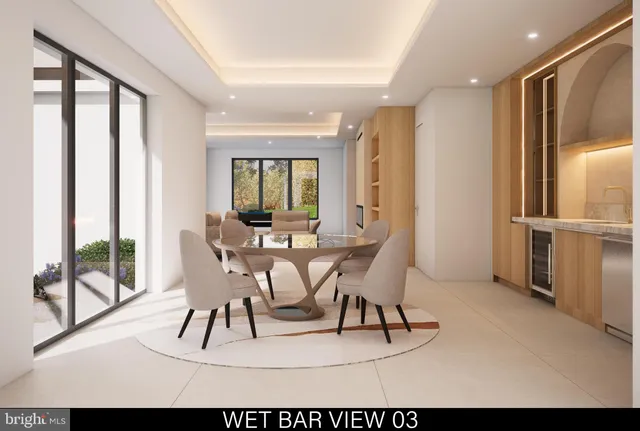 a kitchen with stainless steel appliances a dining table chairs and granite counter tops