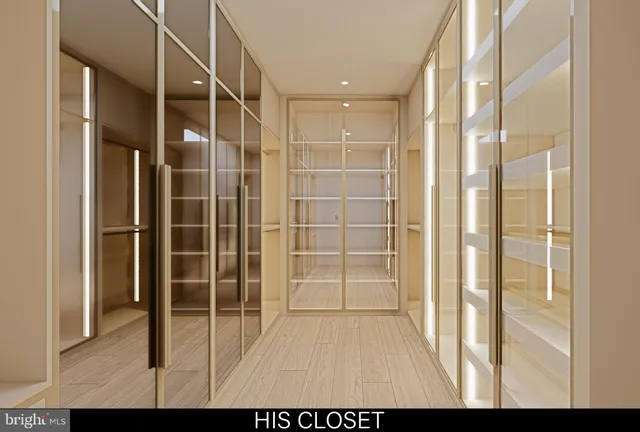 a living room with large window and furniture