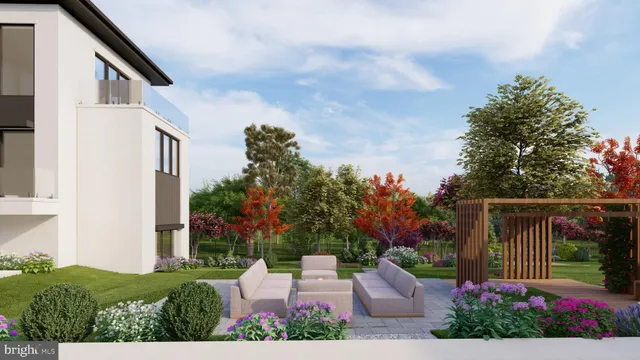 a view of green field with house in background