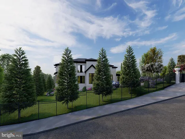 a front view of a house with a garden and yard