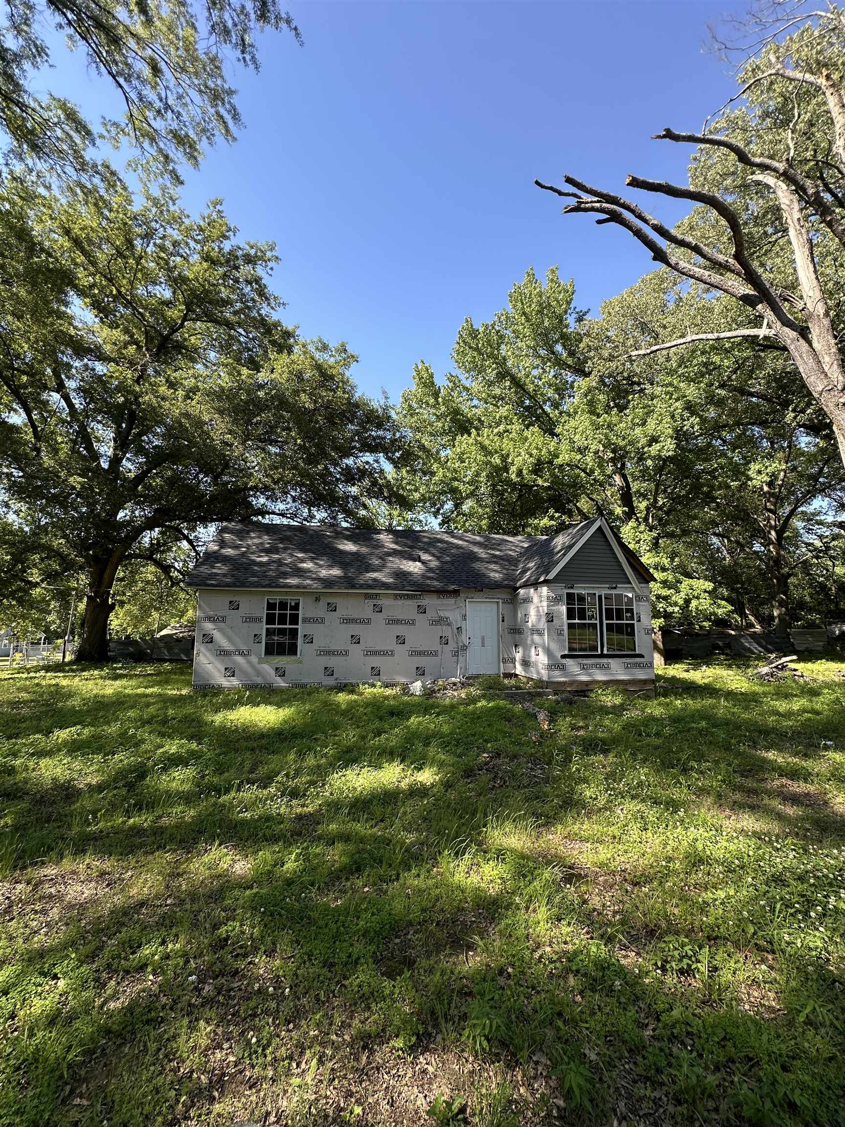 3064 Meadowbrook Road Memphis, TN 38109 - Photo 1 of 14 Rear view of house featuring a lawn