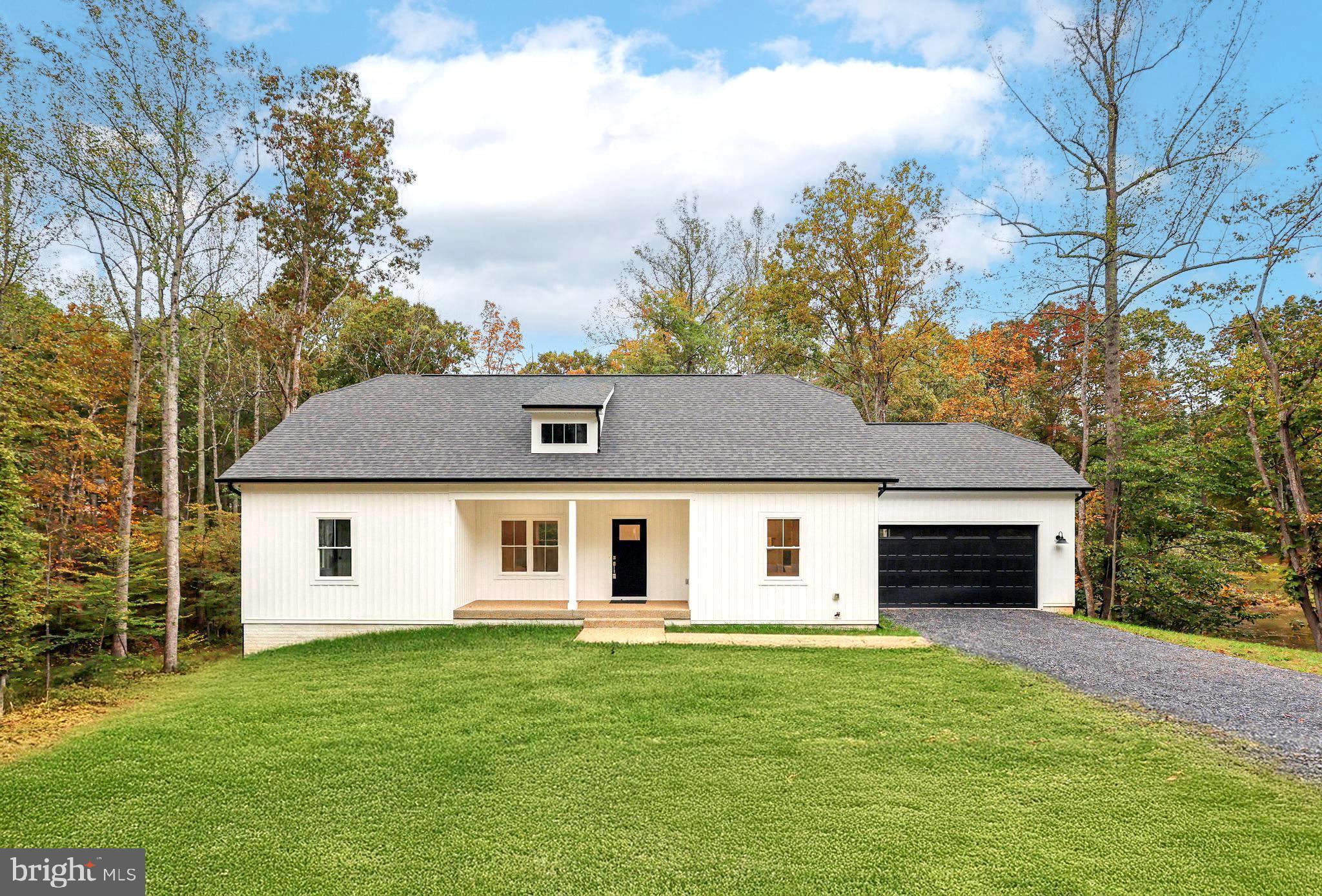 10643 Settle School Road Rixeyville, VA 22737 - Photo 1 of 40 a front view of a house with a garden