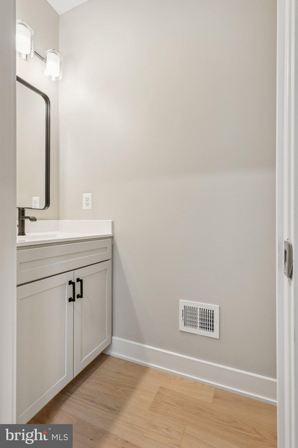 10643 Settle School Road Rixeyville, VA 22737 - Photo 13 of 40 a bathroom with a sink vanity and a mirror