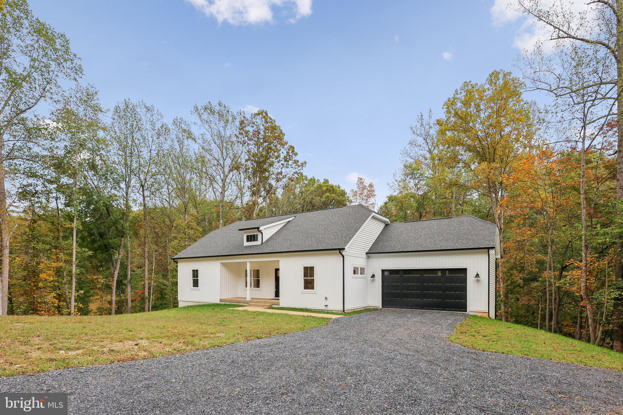 10643 Settle School Road Rixeyville, VA 22737 - Photo 34 of 40 a front view of a house with a yard and garage