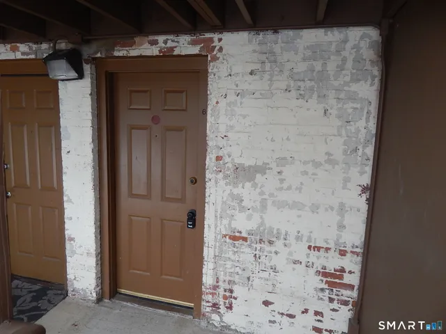 a bathroom with a shower and a sink