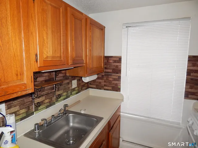 a kitchen with a sink and a window