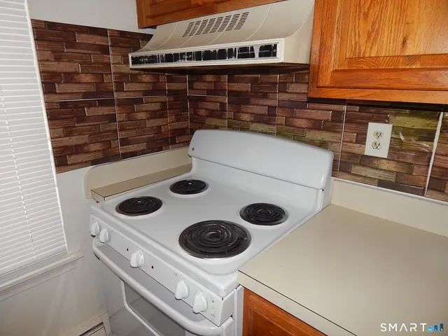a kitchen with a stove and a microwave