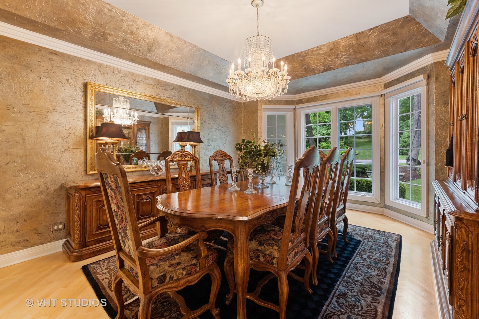 9301 Falling Waters Drive East Burr Ridge, IL 60527 - Photo 16 of 44 a view of a dining room with furniture a chandelier and wooden floor
