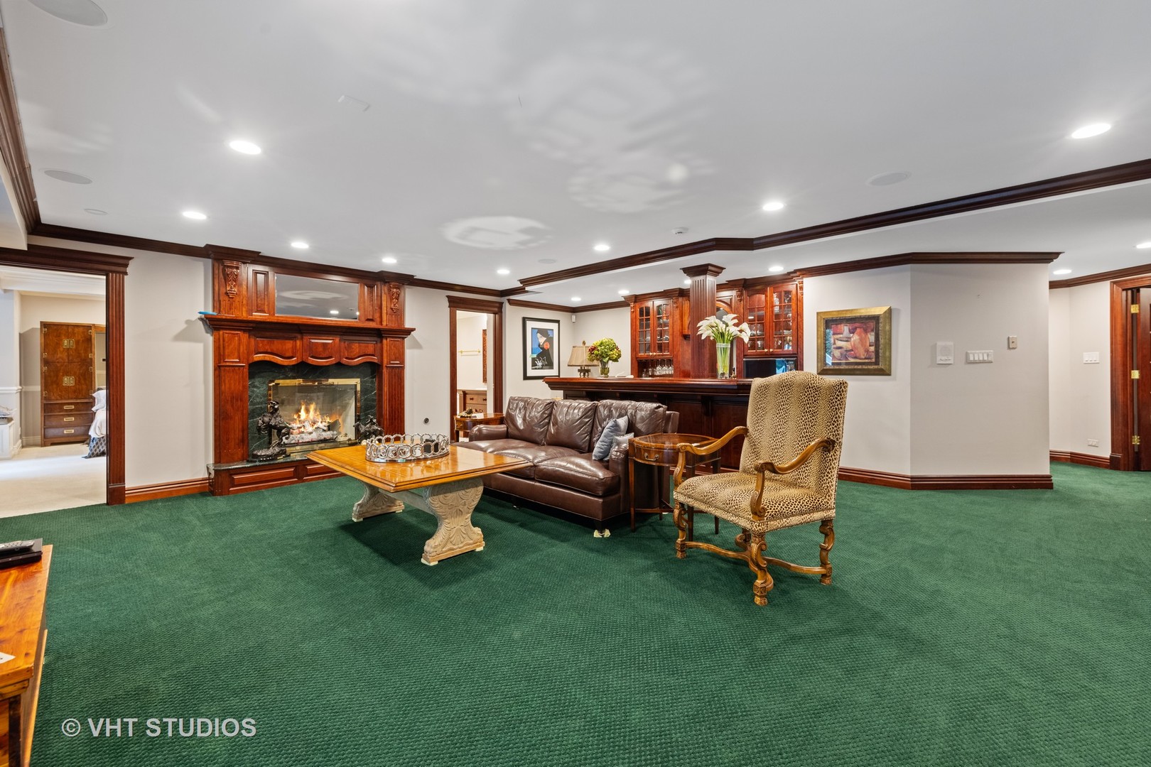 9301 Falling Waters Drive East Burr Ridge, IL 60527 - Photo 26 of 44 a living room with furniture and a fireplace
