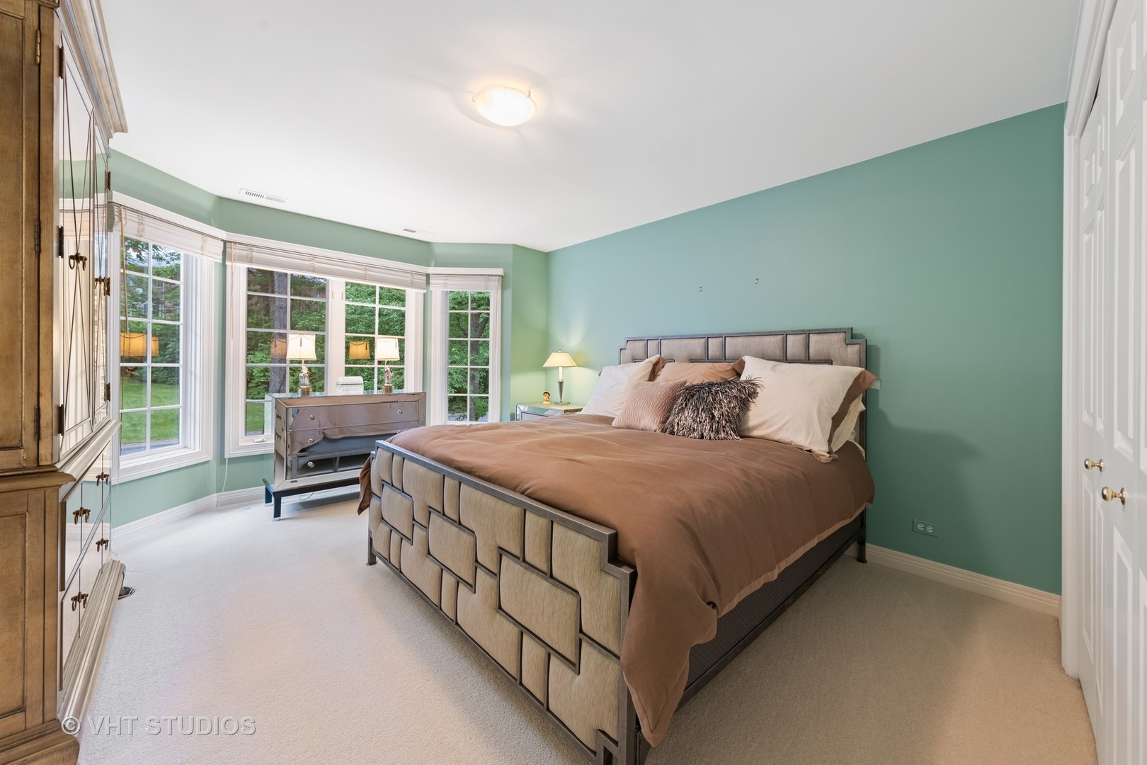 9301 Falling Waters Drive East Burr Ridge, IL 60527 - Photo 30 of 44 a bed room with a bed and a chair