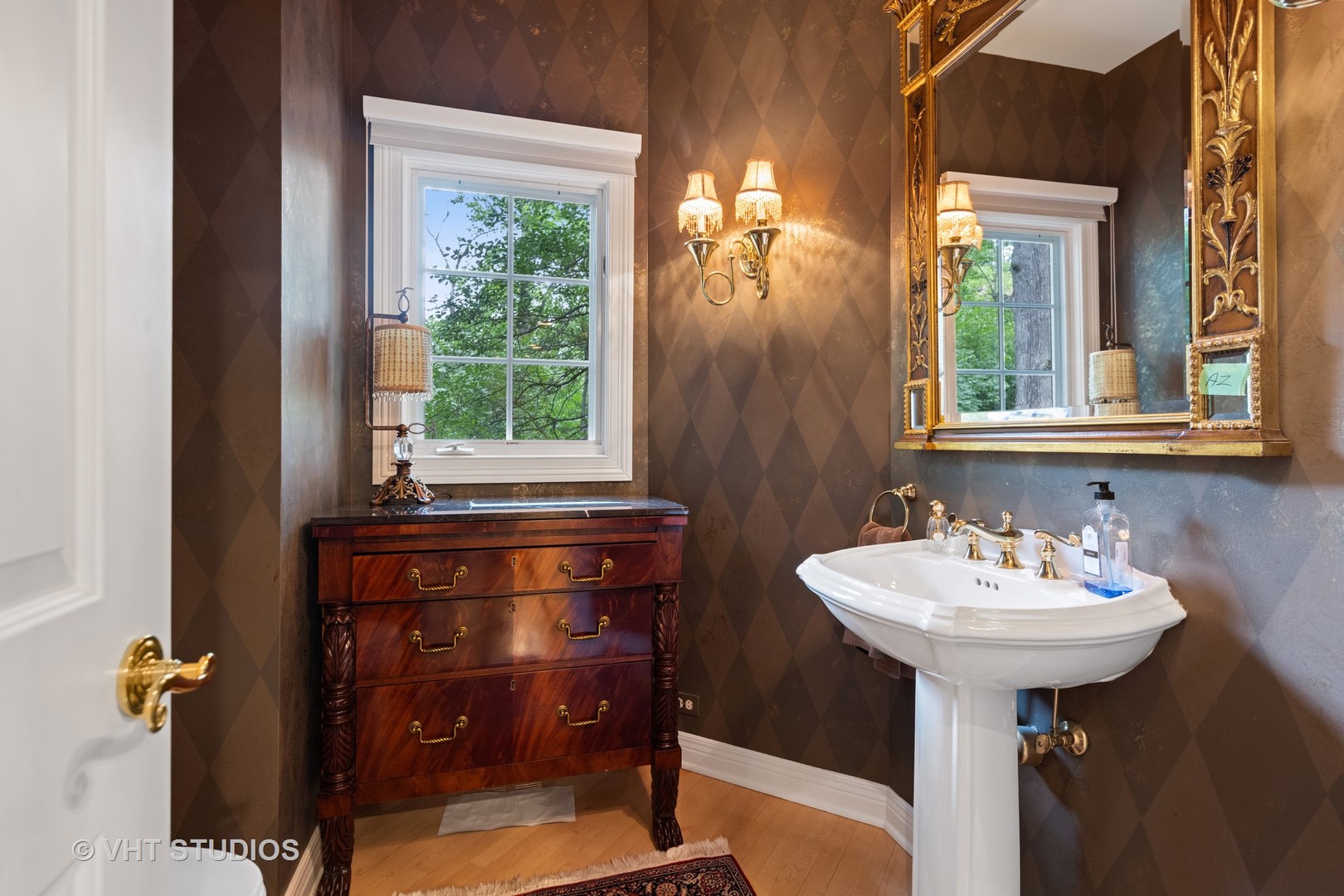 9301 Falling Waters Drive East Burr Ridge, IL 60527 - Photo 10 of 44 a bathroom with a sink a mirror and a window
