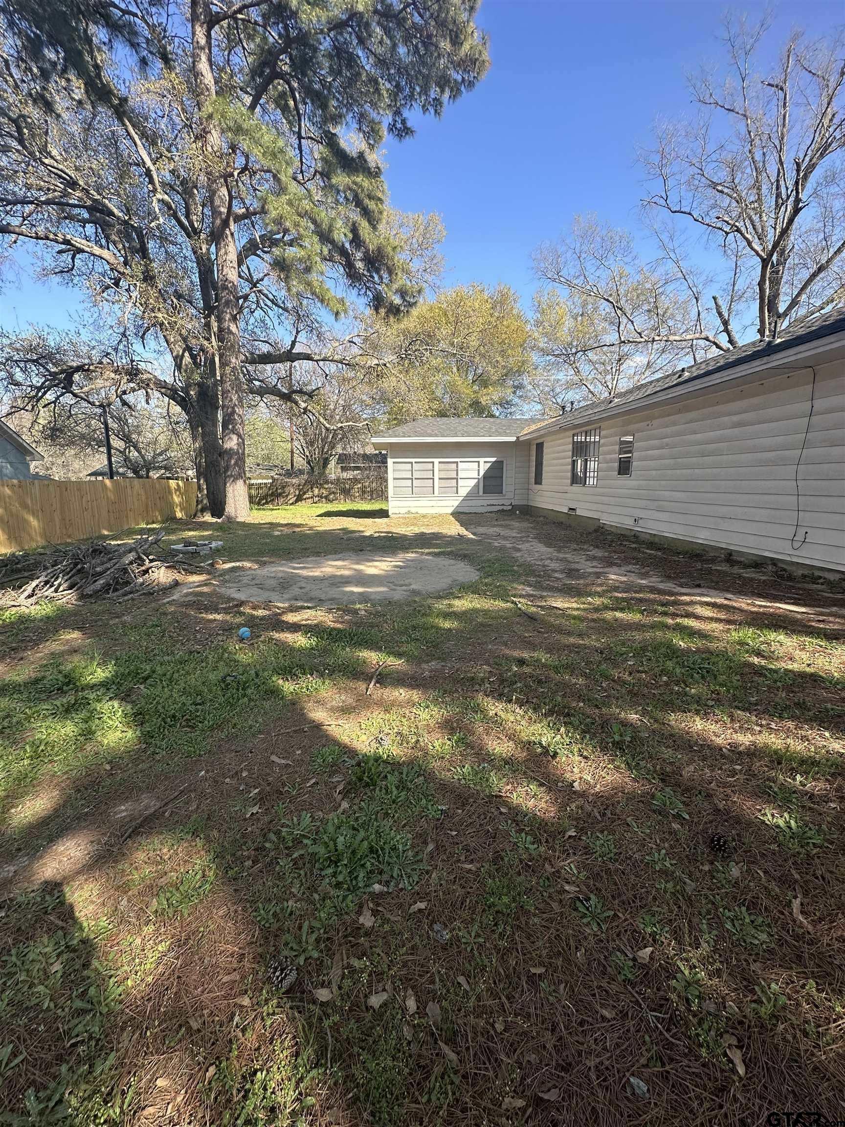 901 Cliff Street Quitman, TX 75783 - Photo 12 of 16 a view of a yard in front of the house