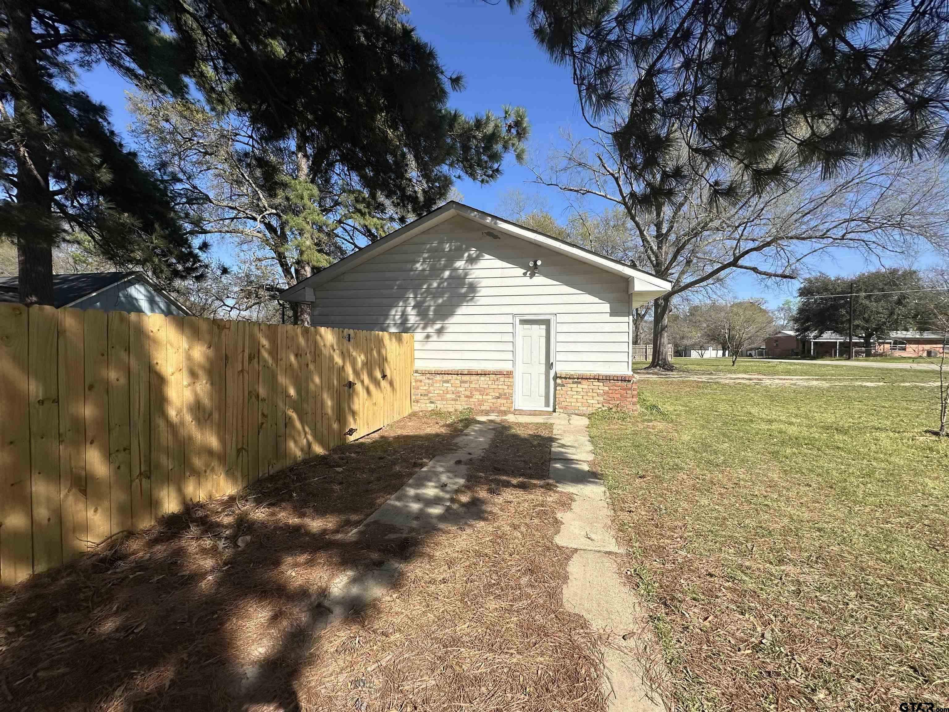 901 Cliff Street Quitman, TX 75783 - Photo 15 of 16 a view of a yard with an outdoor space