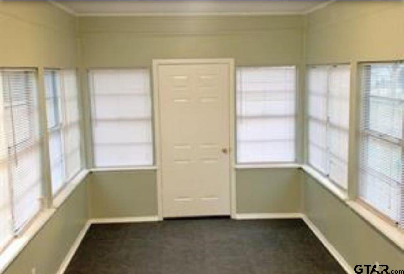 901 Cliff Street Quitman, TX 75783 - Photo 5 of 16 a view of an empty room with a window