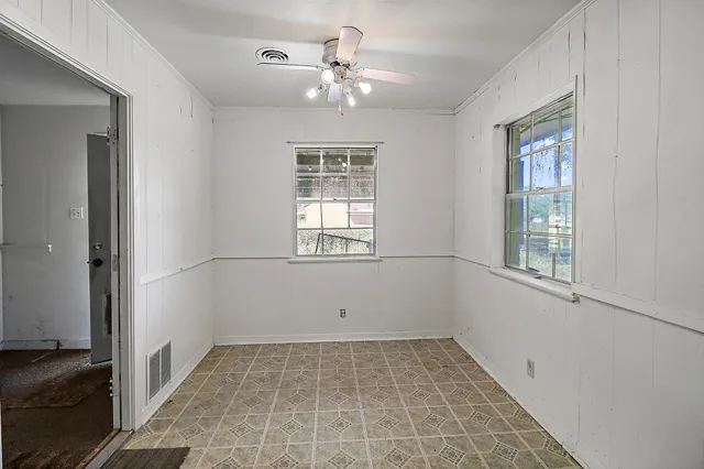 a view of an empty room with a window