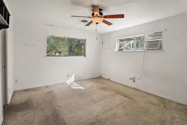 a view of an empty room with a window