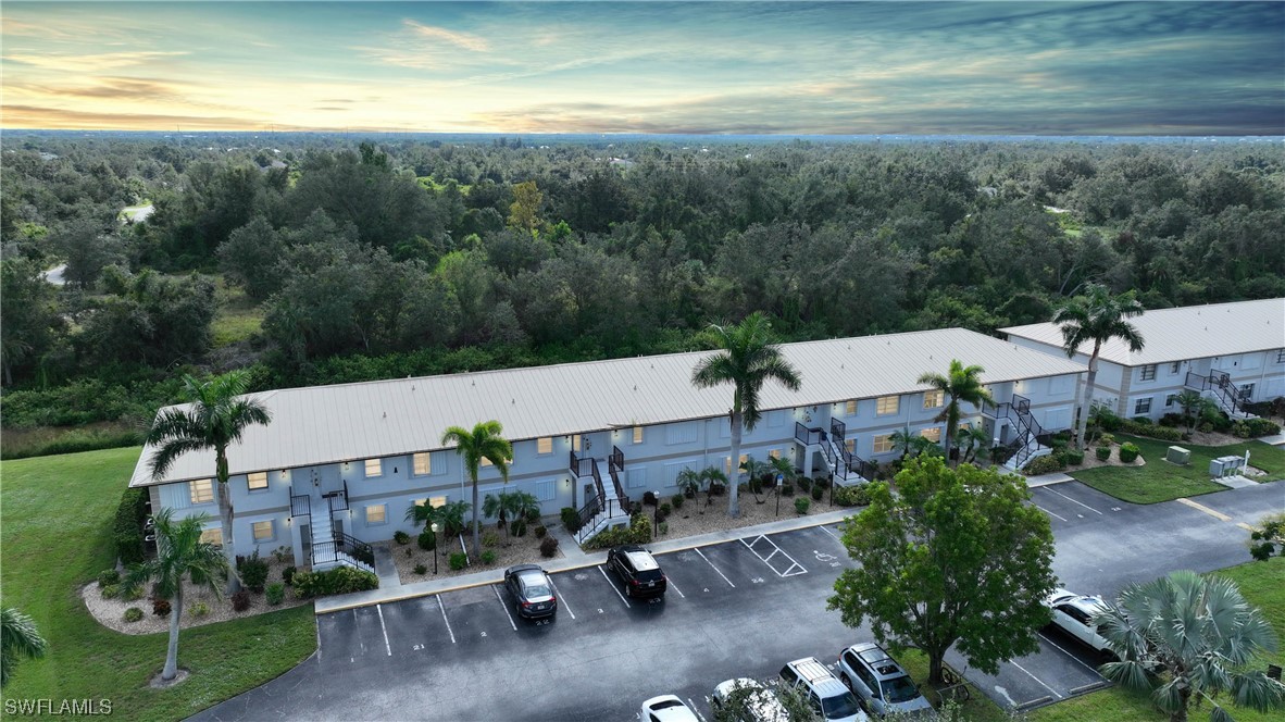 26485 Rampart Boulevard, Unit A6 Punta Gorda, FL 33983 - Photo 1 of 32 an aerial view of a house with pool outdoor seating and yard