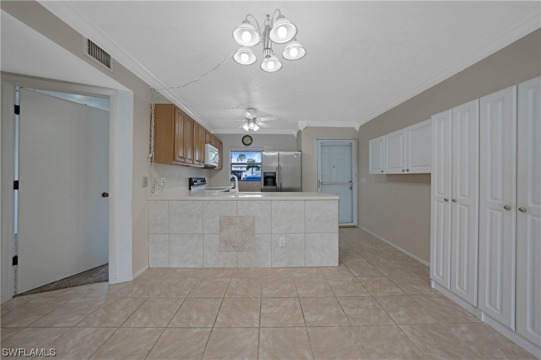 26485 Rampart Boulevard, Unit A6 Punta Gorda, FL 33983 - Photo 12 of 32 a view of a kitchen with a sink and dishwasher