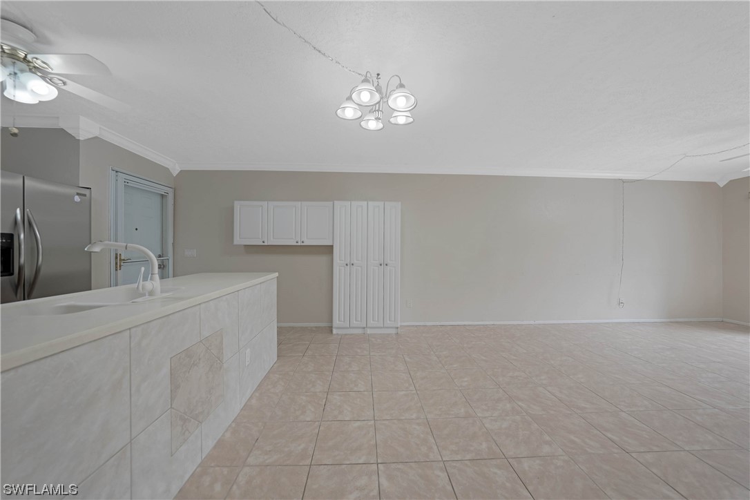26485 Rampart Boulevard, Unit A6 Punta Gorda, FL 33983 - Photo 13 of 32 a spacious bathroom with a sink a mirror and a vanity