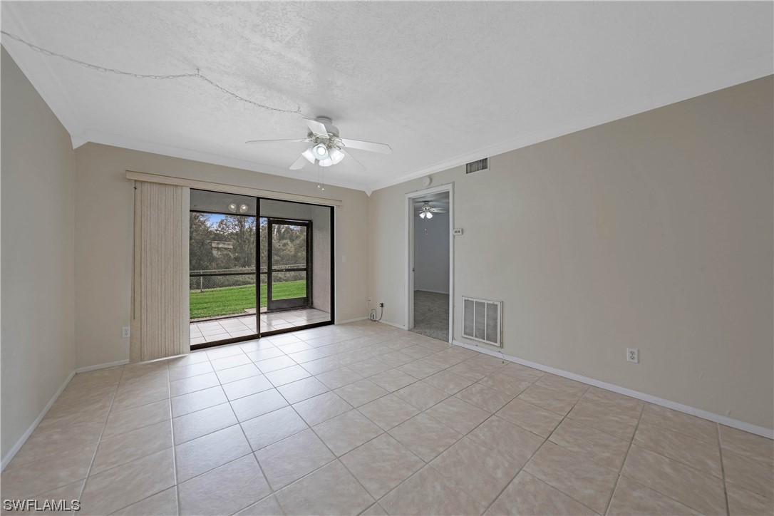 26485 Rampart Boulevard, Unit A6 Punta Gorda, FL 33983 - Photo 15 of 32 a view of an empty room with glass door