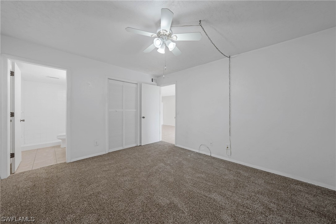 26485 Rampart Boulevard, Unit A6 Punta Gorda, FL 33983 - Photo 20 of 32 a view of a livingroom with a ceiling fan