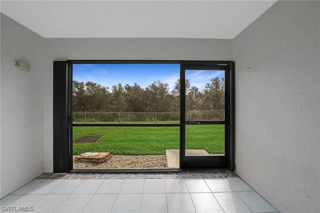 26485 Rampart Boulevard, Unit A6 Punta Gorda, FL 33983 - Photo 27 of 32 a view of a back yard from a room