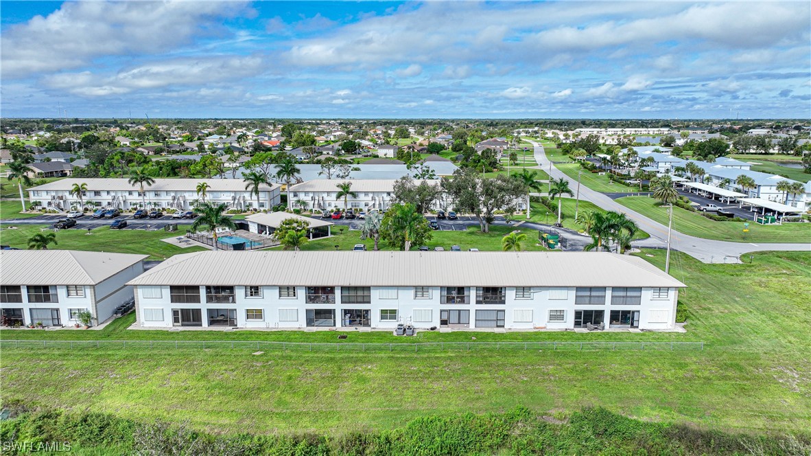 26485 Rampart Boulevard, Unit A6 Punta Gorda, FL 33983 - Photo 29 of 32 a front view of a house with a garden